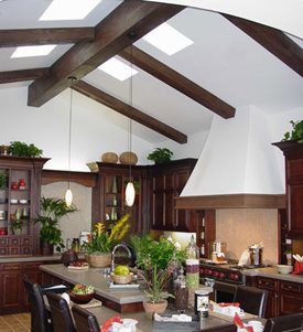 Faux wood beams on a vaulted ceiling with highlights